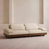 Cream Art Deco floor sofa with pillow back, pillow top arms, slipcover, and multiple pillows for seating 2 to 4 people main product image